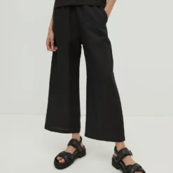 EDITED Pantalons Wide Leg Broek Nona Dames Zwart -About You Winkel 0b2706181d722ac39cc9dc2248e8658a scaled