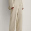 NA-KD Pantalons Loosefit Broek Dames Crème -About You Winkel 7988b73c9784ce56aaa51afce67b28db scaled