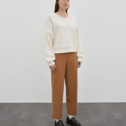 EDITED Pantalons Slimfit Broek Jeanelle Dames Beige -About You Winkel adba2f6d2c1ab0c311392925c0084b4d scaled